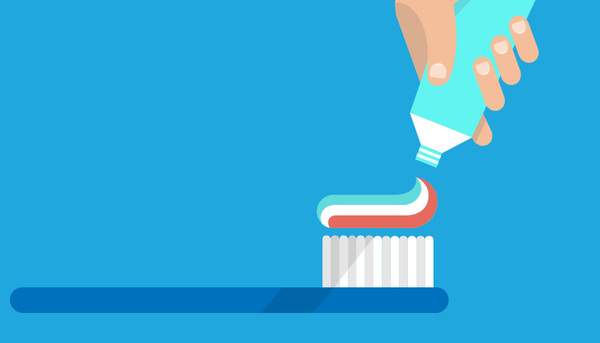 歯ブラシに歯磨き粉をのせているイメージ図